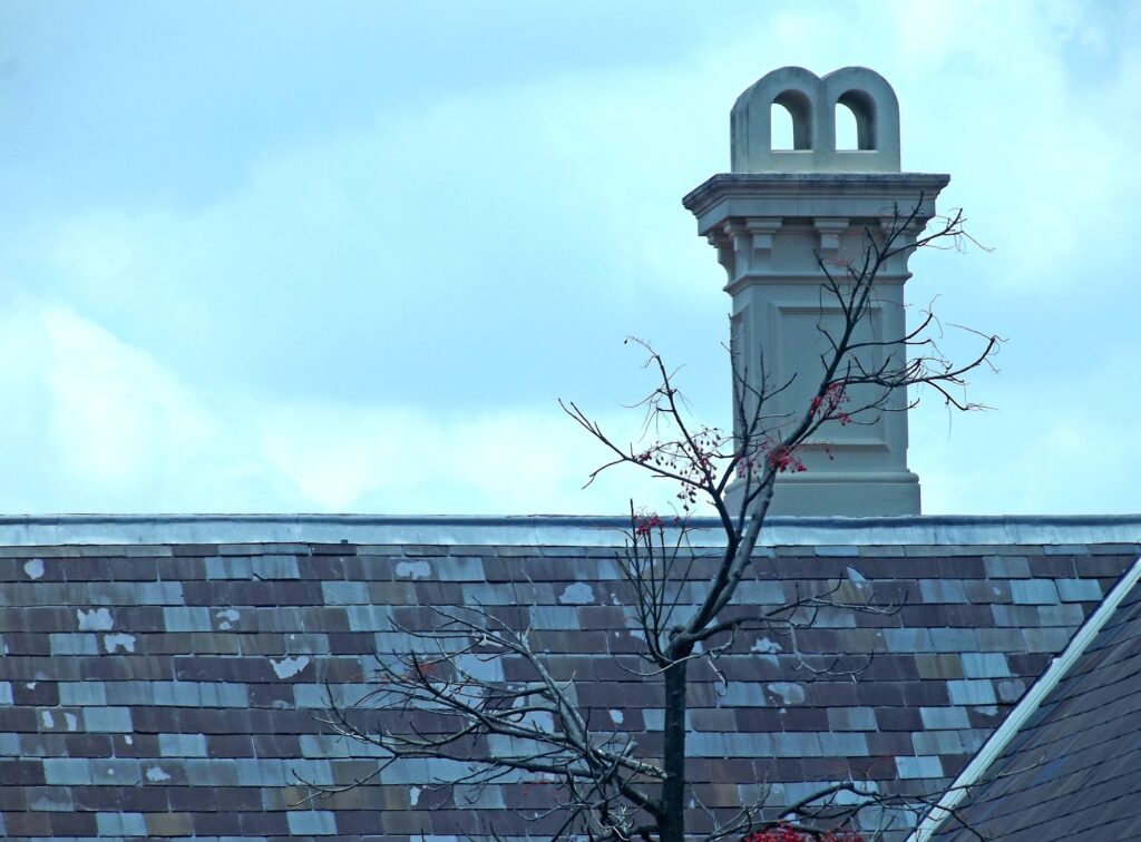 Chimney on an old tiled roof